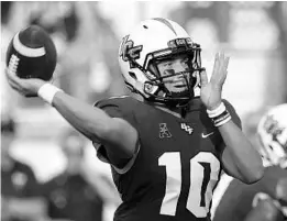  ?? JOHN RAOUX/ASSOCIATED PRESS ?? UCF quarterbac­k McKenzie Milton looked steadier against FIU in the season opener than he did in his debut last year against Maryland, a game where he had 6 fumbles.