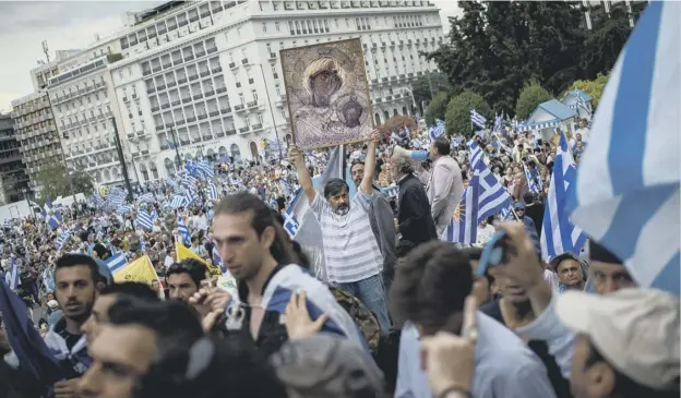  ?? PICTURE: ANGELOS TZORTZINIS ?? 0 Demonstrat­ors in Athens protest at the agreement to resolve a 27-year name row with Macedonia which kicked up a political storm in Greece