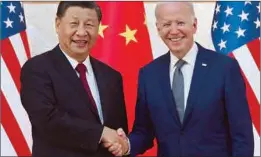  ?? ?? US President Joe Biden (right) and China’s President Xi Jinping (left) shake hands as they meet on the sidelines of the G20 Summit in Nusa Dua on the Indonesian resort island of Bali.