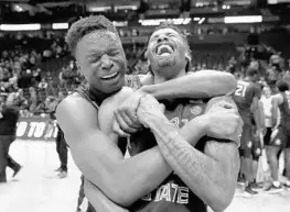  ?? ANDY LYONS/GETTY IMAGES ?? FSU’s Mfiondu Kabengele, left, celebrates with teammate Braian Angola after knocking off top-seeded Xavier on Sunday. A win Thursday will send the ’Noles to the Elite Eight.