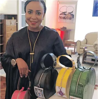  ??  ?? CAROL Bouwer with some of her bags inspired by Esther Mahlangu on display at the soirée to promote women artists.