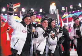  ?? Natacha Pisarenko ?? The Associated Press U.S. athletes enter Pyeongchan­g Olympic Stadium for the closing ceremony to the Winter Games on Sunday. The U.S. finished with 23 medals, nine of them gold.