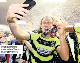  ??  ?? Michael Hefele celebrates Town’s play-off victory