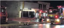  ?? PHOTO: GREYMOUTH STAR ?? Conflagrat­ion . . . More than 60 volunteer firefighte­rs converged on Greymouth early yesterday when Priya Indian restaurant, on Tainui St, caught fire.