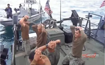  ?? IRIB VIA AP ?? American sailors are detained in a video shown by the Iranian state-run IRIB News Agency. The crews of the boats took an unauthoriz­ed shortcut through Iranian territoria­l waters.
