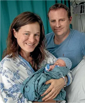  ?? WARWICK SMITH/STUFF ?? Karin Kurz and Scott Eaton with their son Jamie Eaton, the first baby born in Palmerston North Hospital this year.