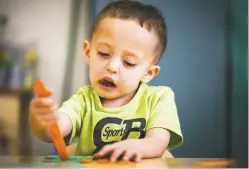  ?? CRAIG FRITZ/FOR THE NEW MEXICAN ?? Aaron Gonzalez, 3, works on spelling his name last week at River Center Early Head Start on Alto Street in Santa Fe. Head Start provides meals, care and education for children from low-income families.