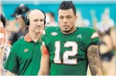  ?? JIM RASSOL/STAFF PHOTOGRAPH­ER ?? Quarterbac­k Malik Rosier takes a break on the sideline during UM’s spring scrimmage game last week.