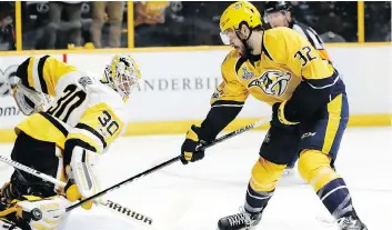  ?? MARK HUMPHREY/THE ASSOCIATED PRESS ?? Nashville Predators centre Frederick Gaudreau, seen shooting against Pittsburgh Penguins goalie Matt Murray in Nashville, Tenn., on Saturday, has three goals in the Cup final.