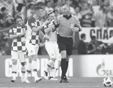  ?? PETR DAVID JOSEK/THE ASSOCIATED PRESS ?? Croatia’s Ivan Perisic argues with referee Nestor Pitana during Sunday’s World Cup final against France in Moscow. Pitana’s officiatin­g drew the ire of the Croatian team, and its fans, during France’s 4-2 victory.