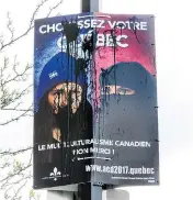  ?? PAUL CHIASSO / THE CANADIAN PRESS ?? A vandalized campaign poster shows two photos of the same woman, one in which she is sporting a tuque with the Fleur-de-lis, the other in which she wears a niqab.