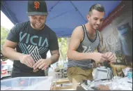  ?? BEA AHBECK/NEWS-SENTINEL ?? Vicia’s co-owners Nathan Flood and Jerimiah Patterson prepare samples as they work their booth at the farmers market in Downtown Lodi on Thursday.