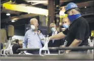  ?? MATT SLOCUM — THE ASSOCIATED PRESS ?? From left, Democratic presidenti­al candidate Joe Biden, U.S. Sen. Bob Casey, D-Pa., and McGregor Industries owner Bob McGregor listen to First Class Fitter Michael Phillips during a tour of the metal fabricatin­g facility in Dunmore, Pa., on Thursday.