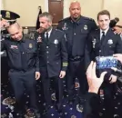  ?? JOSE LUIS MAGANA/AP ?? From left, Capitol Police officer Aquilino Gonell, D.C. officer Michael Fanone, Capitol officer Harry Dunn and D.C. officer Daniel Hodges after testifying to Congress on Tuesday.