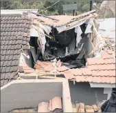  ??  ?? The roof after the car plunged into the home.