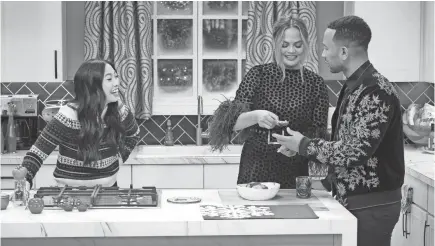  ?? PAUL DRINKWATER/NBC ?? Awkwafina joins wife-and-husband team Chrissy Teigen and John Legend to cook up some good old-fashioned holiday cheer tonight on NBC’s “A Legendary Christmas with John and Chrissy.”