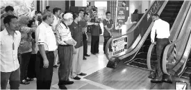  ??  ?? The demonstrat­ion on the proper usage of escalator at Harbour Mall Sandakan, yesterday.