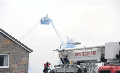  ?? Picture: David Wardle. ?? Firefighte­rs tackling the blaze at Forth Bay Nursing Home in Kincardine.