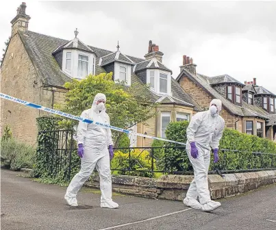  ?? Picture: SWNS. ?? Forensic officers and police at the home of Arnold Mouat in Bo’ness, West Lothian.