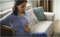  ??  ?? Heartburn is unmistakab­le, but you could also have silent reflux. We look at these two pesky niggles of pregnancy.