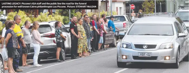  ??  ?? LASTING LEGACY: Piccone's IGA staff and the public line the road for the funeral procession for well known Cairns philanthro­pist Lou Piccone. Picture: STEWART McLEAN
