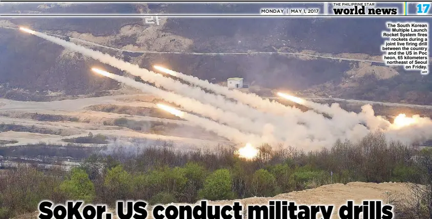  ??  ?? The South Korean Multiple Launch Rocket System fires rockets during a joint live firing drill between the country and the US in Poc heon, 65 kilometers northeast of Seoul on Friday.