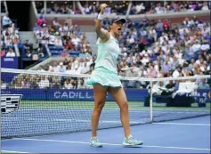  ?? FRANK FRANKLIN II — THE ASSOCIATED PRESS ?? Iga Swiatek gets pumped up after winning a point against Ons Jabeur during her victory in the women's singles final at the U.S. Open on Saturday.