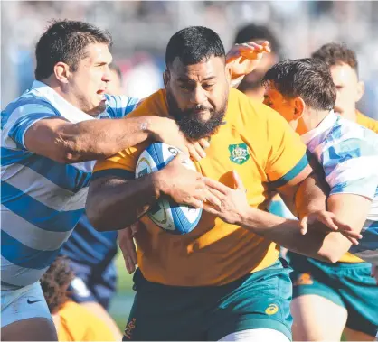  ?? Picture: Rodrigo Valle. ?? A proposal by the Rugby Football Union and World Rugby wants to lower the legal tackle height in all competitio­ns below the elite level. If adopted at Test level, would this tackle on Wallabies prop Taniela Tupou during the game against Argentina become a penalty offence?