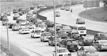  ??  ?? To preserve its highways, PLUS adopts a three-pronged maintenanc­e strategy which includes routine, curative and preventive maintenanc­e. — Bernama photo