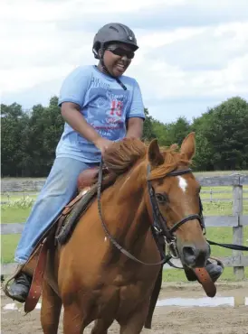  ??  ?? 15-year-old tariq has become more confident through the detroit horse Power program.