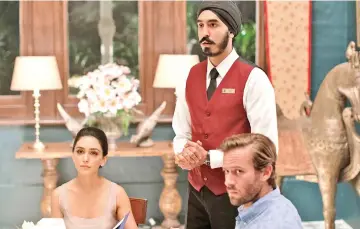  ??  ?? From left: Nazanin Boniadi, Dev Patel and Armie Hammer play characters trapped inside a luxury hotel that has been taken over by militant Islamic terrorists. — Photo by Mark Rogers, Bleecker Street