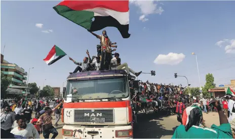  ?? AFP ?? Flag-waving pro-democracy demonstrat­ors on the streets of Sudanese capital Khartoum on Thursday