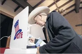  ?? Irfan Khan Los Angeles Times ?? RUBEN SEDANO votes at the Lincoln Heights Senior Center. Future races will shift to even years to coincide with the gubernator­ial and presidenti­al schedules.