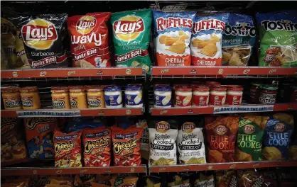  ?? JUSTIN SULLIVAN GETTY IMAGES FILE PHOTO ?? Several retailers have received notice of a 10 to 11 per cent price hike from the snack food conglomera­te Frito-lay.