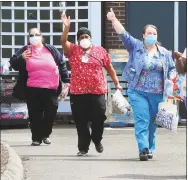  ?? Christian Abraham / Hearst Connecticu­t Media ?? Health care workers wave during a cheer line set up to honor employees at the change-of-shift at Bishop Wicke nursing home on Long Hill Avenue in Shelton in May. A temporary order is relaxing nurse aide training requiremen­ts to ensure nursing homes get through staffing shortages caused by the pandemic.