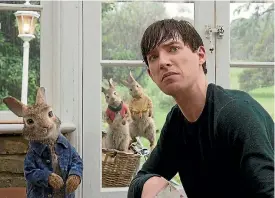  ??  ?? Domhnall Gleeson plays Mr Mcgregor in a new adaptation of Beatrix Potter’s Peter Rabbit.