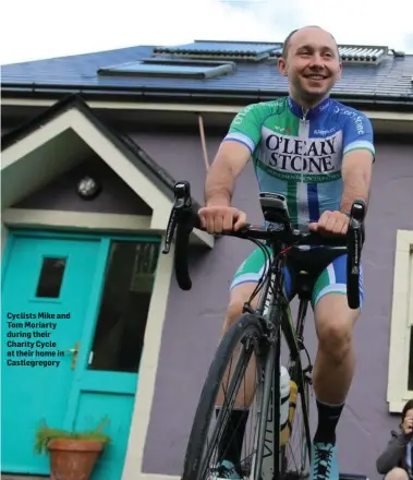  ??  ?? Cyclists Mike and Tom Moriarty during their Charity Cycle at their home in Castlegreg­ory