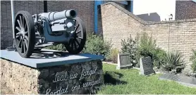  ??  ?? BEING MOVED: The old cannon at the Moth Hall. Joseph Crowe’s grave is to the right