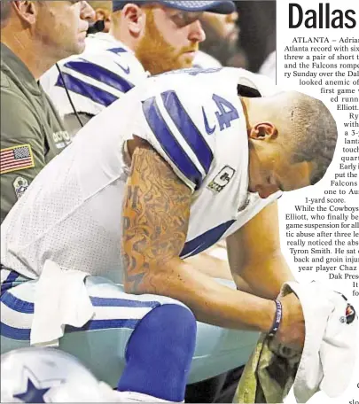  ?? AP ?? Dak Prescott bows head on bench after getting bowled over by Falcons defense as Cowboys allow eight sacks on day, letting Falcons celebrate in Atlanta (r.).