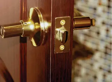  ?? SabOlga/Shuttersto­ck ?? Solid natural wood front doors are gorgeous, so you do not want to select an ordinary-looking lockset in it.