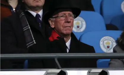  ?? Photograph: Matthew Ashton/AMA/Getty Images ?? Sir Bobby Charlton watches a Manchester derby last December.