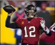  ?? JULIO CORTEZ - THE ASSOCIATED PRESS ?? Tampa Bay Buccaneers quarterbac­k Tom Brady (12) throws a pass during the second half of an NFL wild-card playoff football game against the Washington Football Team, Saturday, Jan. 9, 2021, in Landover, Md.