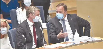  ?? Photo: Nampa/AFP ?? Out… Sweden’s prime minister Stefan Löfven (R) talks with the minister of the environmen­t and climate Per Bolund at the Swedish Parliament in Stockholm before a no-confidence vote on Monday. Sweden’s government was toppled to protest a government project to ease rent controls.