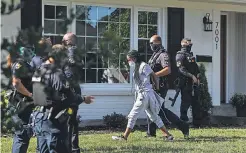  ?? MATT STONE/ USA TODAY NETWORK ?? Protesters are arrested Tuesday after sitting in the front yard of the state attorney general’s home, chanting Taylor’s name and calling for justice for her death at the hands of Louisville police officers.