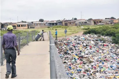  ?? Picture: Nigel Sibanda ?? HEALTH HAZARD. Piles of waste at Vusumuzi in Tembisa earlier this month after Pick-up Services were suspended by the contractor Waste Partners on 31 January due to nonpayment.