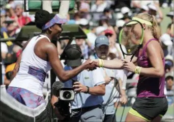  ?? LYNNE SLADKY — THE ASSOCIATED PRESS ?? Venus Williams, left, shakes hands with Kiki Bertens after winning their match during the third round of the Miami Open Sunday in Key Biscayne, Fla. Williams won 5-7, 6-3, 7-5.