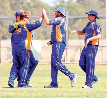  ?? ?? Nick Fairbank congratula­tes Jeremy Gray after getting the wicket of Aiden Phillips. Page 54 WARRAGUL AND DROUIN GAZETTE March 15 2022