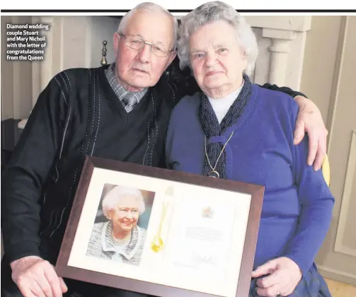  ??  ?? Diamond wedding couple Stuart and Mary Nicholl with the letter of congratula­tions from the Queen