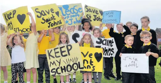  ?? Eddie Garvey ?? ●●Pupils at St John’s Primary School campaign to save their school