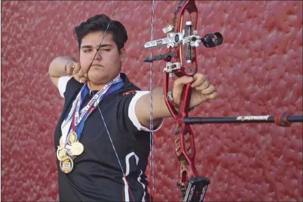  ?? KARINA LOPEZ ?? Pablo Niebla holds his aim for a photo outside Calexico High on Wednesday morning.